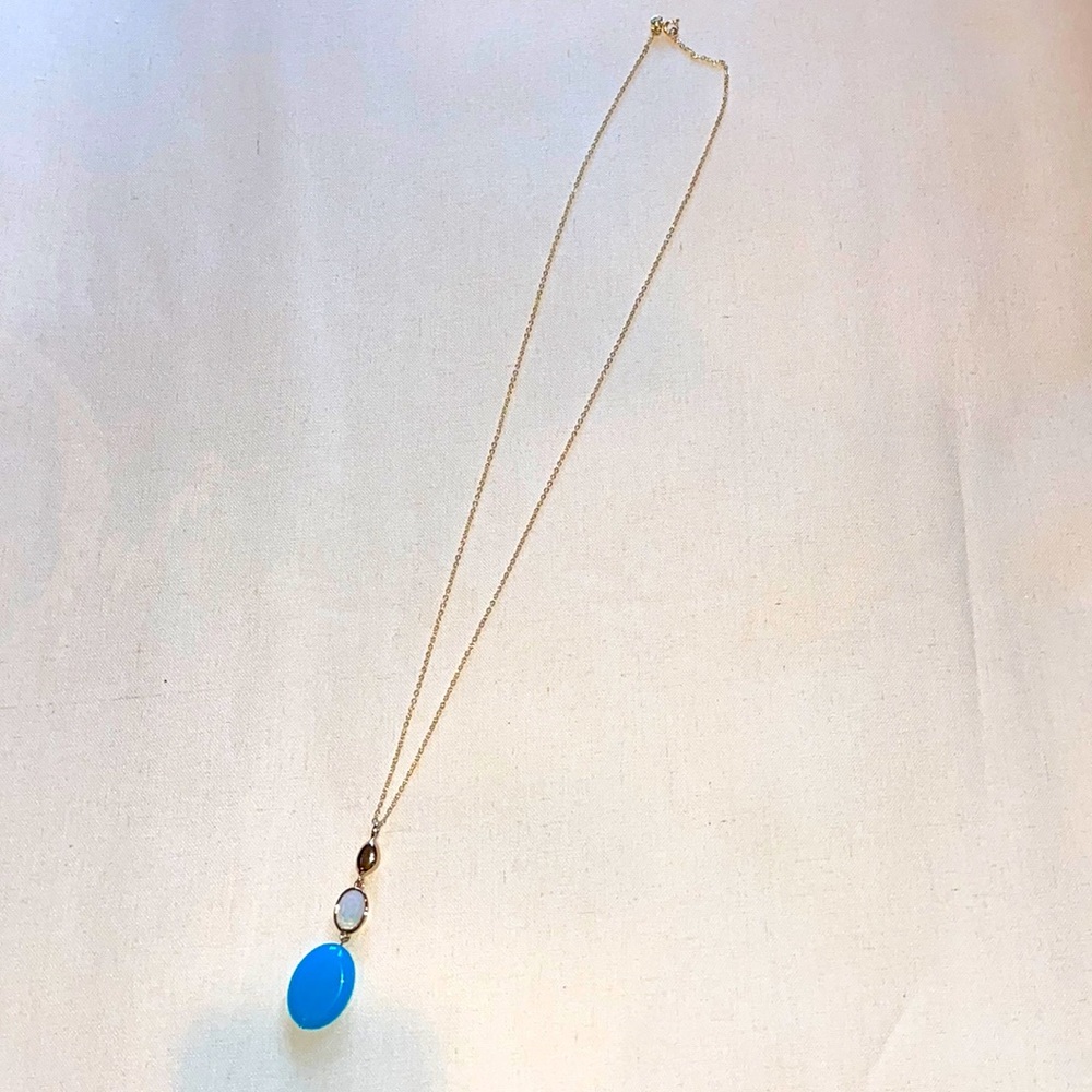 Gold necklace with blue bead tassel